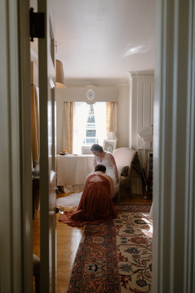 bride and mother get ready for glen magna farms wedding