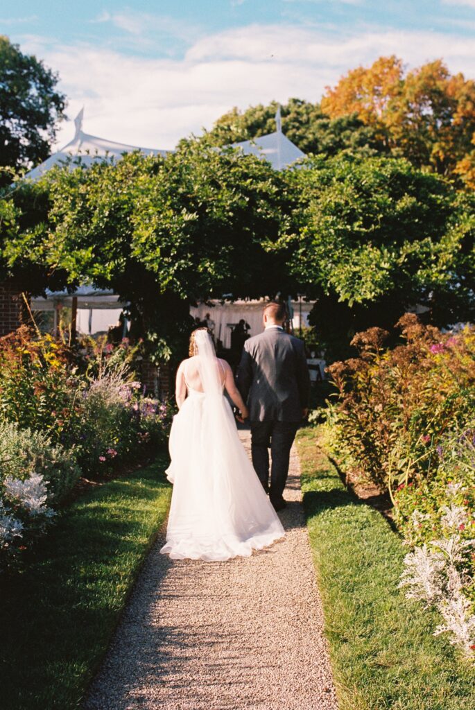 bride and groom walking away for glen magna farms wedding photos