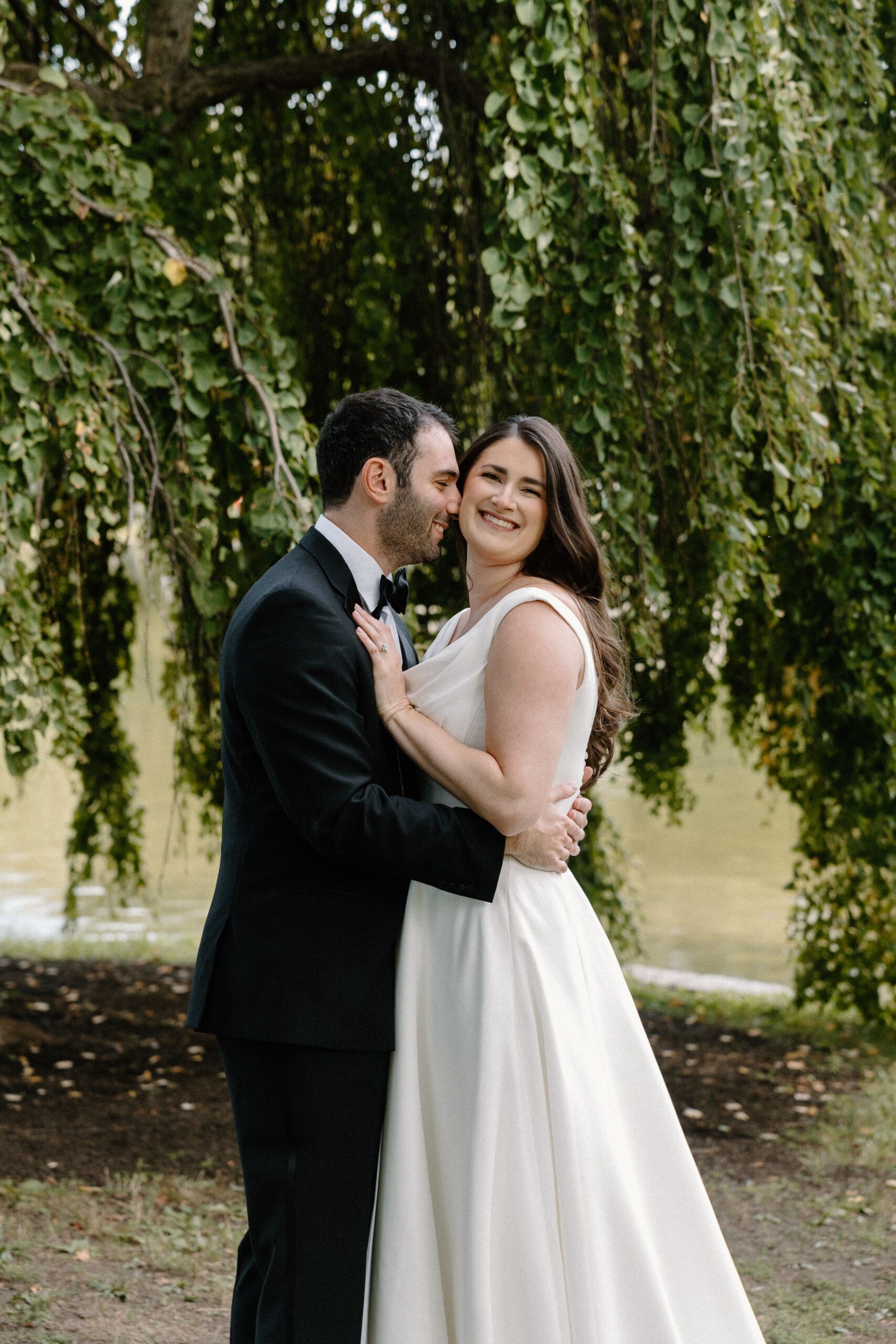 Couple smiling together after their Boston Public Garden wedding ceremony.