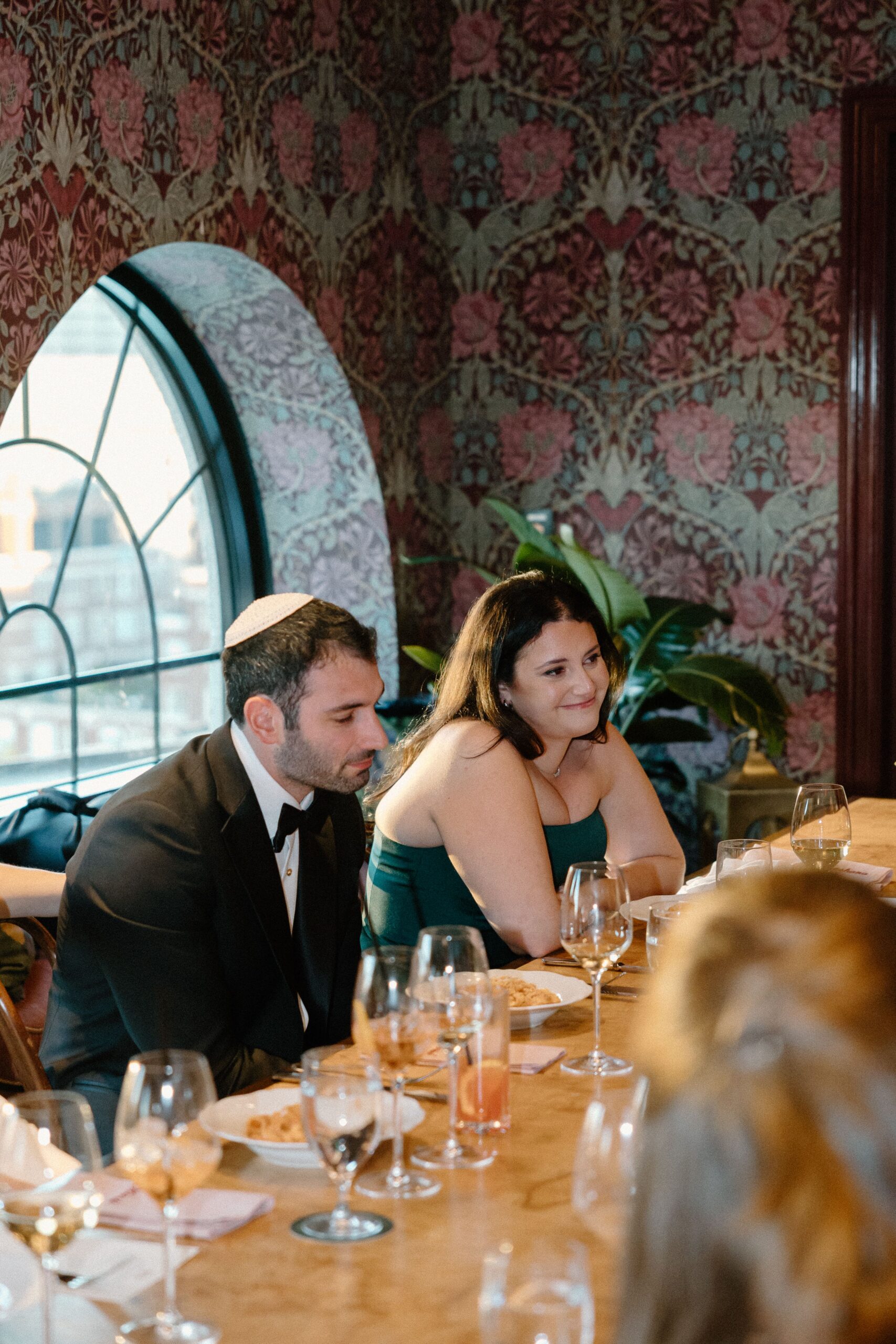 Newlyweds celebrating with dinner after their Boston Public Garden wedding.